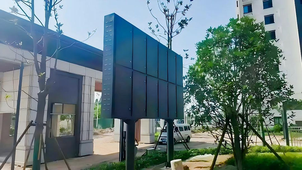 Outdoor full-color LED display installed on a double-column steel structure at a residential community entrance.