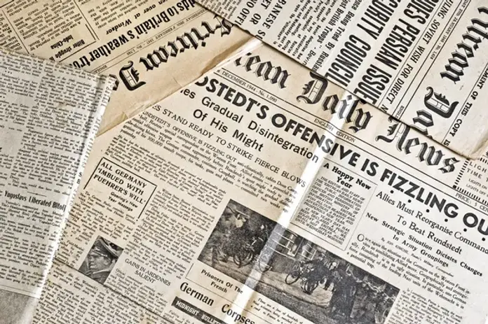 depositphotos_5579067-stock-photo-ancient-newspapers.webp