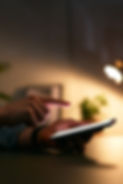 Close Up Of Woman Using Mobile Phone At Home At Night With Illuminated Screen.jpg