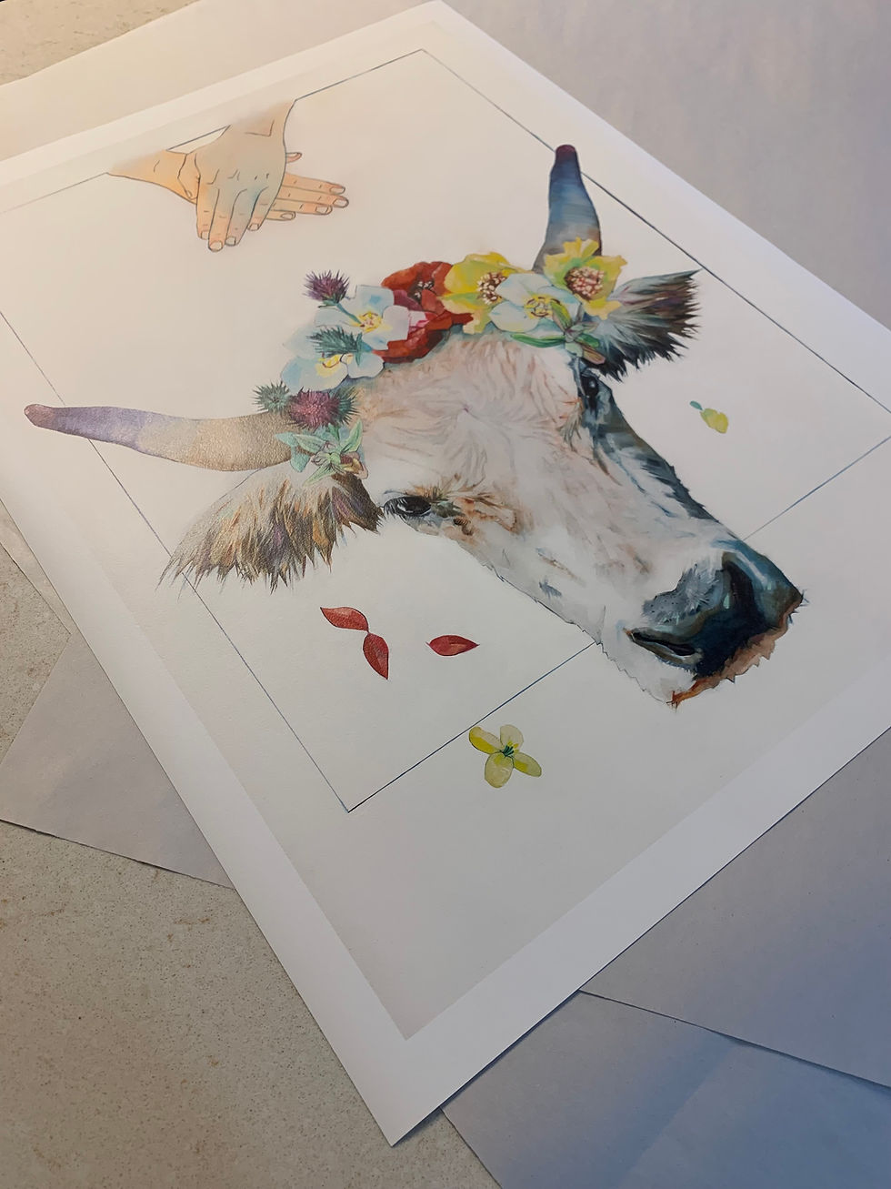 Thumbnail: Print of oxen painting laying flat on counter at an angle