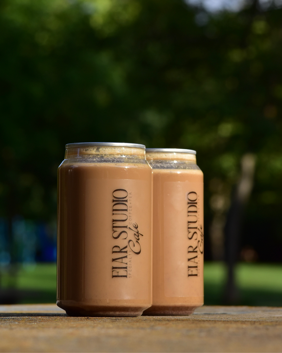 chai cans pictured in a scenic field 