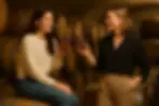 two ladies holding AuVin perfume bottle mockup
