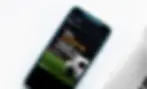 phone with a social media post on the screen