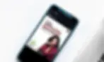 phone with a social media post on the screen