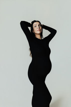 Fine art maternity portrait in Sandy Utah studio featuring expectant mother celebrating pregnancy.
