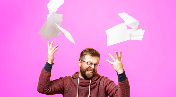 man-tossing-paper-in-the-air-on-yellow-background-2026-09-21-13-07-43-utc.jpg