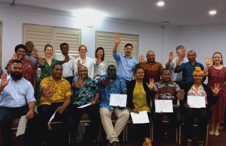 Module 3 whole cohort doing Stop TB sign.jpeg