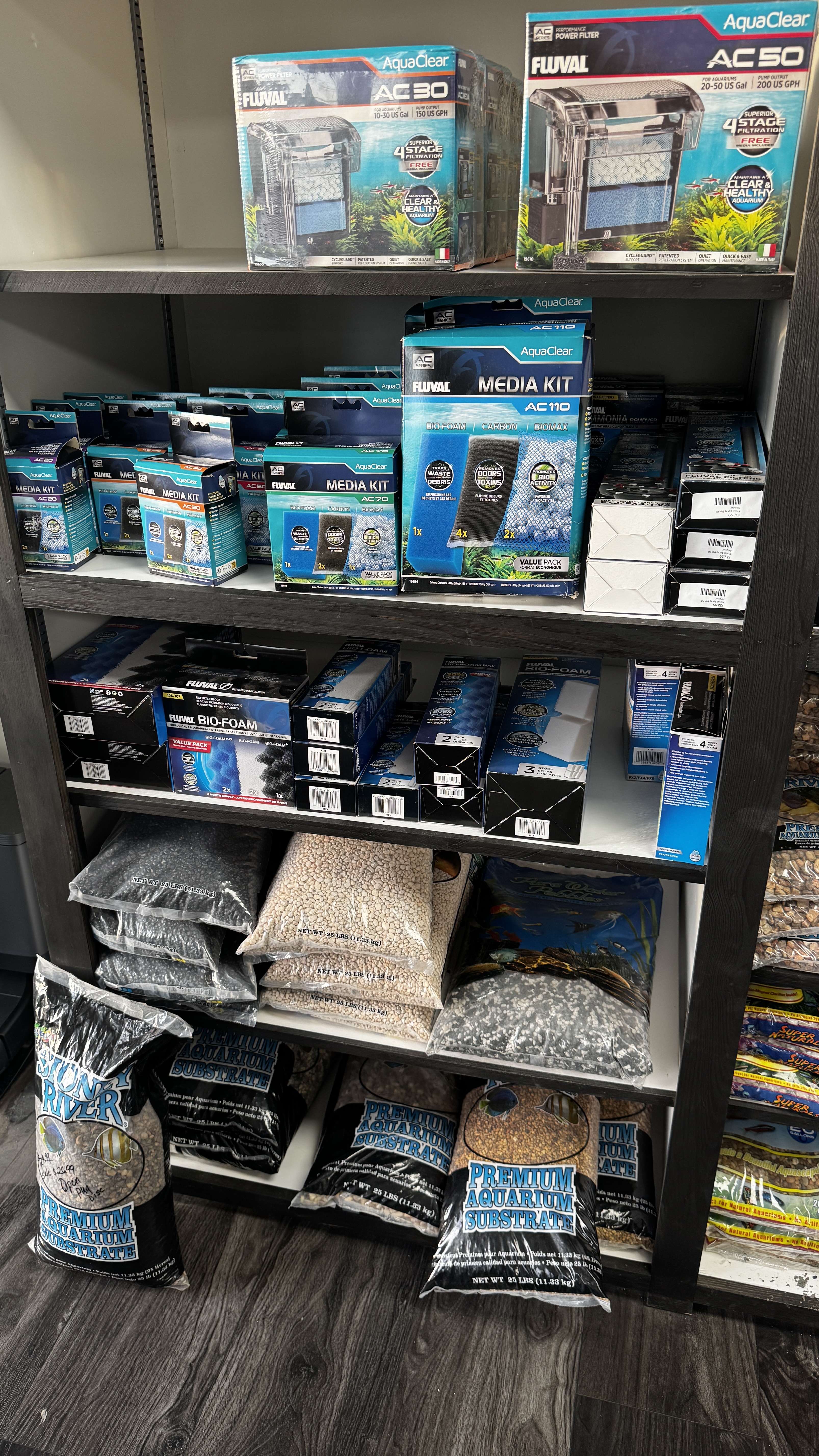 Stocked aquarium supplies and tanks inside Fins For Grins
