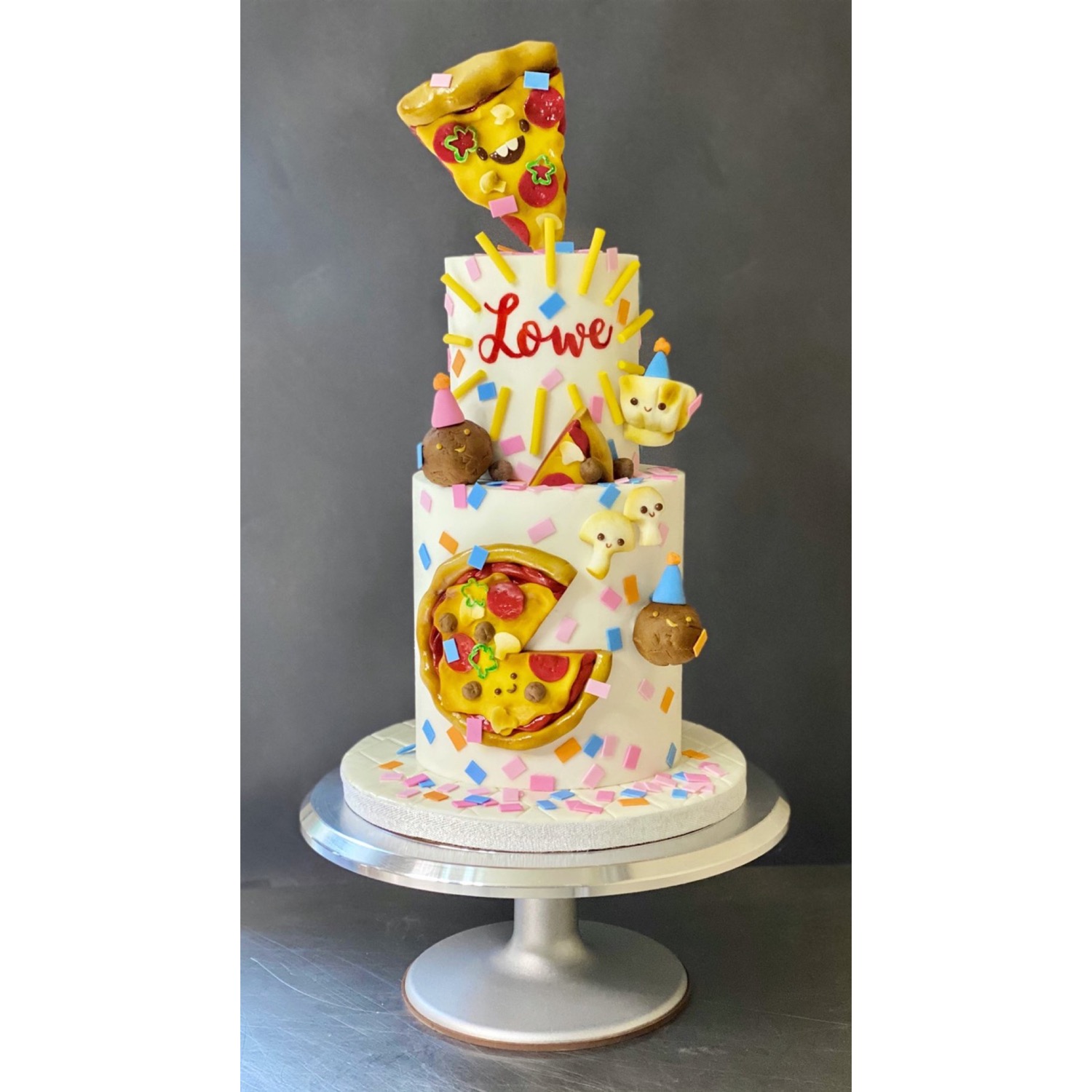 Whimsical pizza party cake
