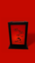 Black framed table lamp with Snoopy illustration glowing in red light, isolated on red background.