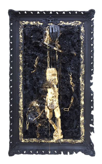 Cut the Strings, a gold puppet on strings held by a black hand with a second hand holding scissors, on a black panel by Lia Kaprini