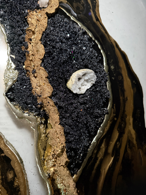 Close-up of gold-leaf veins through black resin on the Obsidian Echo artwork