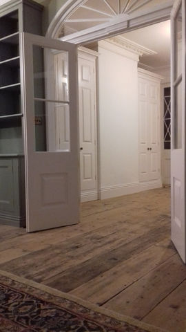 entrance hall j. The two coat cupboards either side of the false chimney breast, complete 
