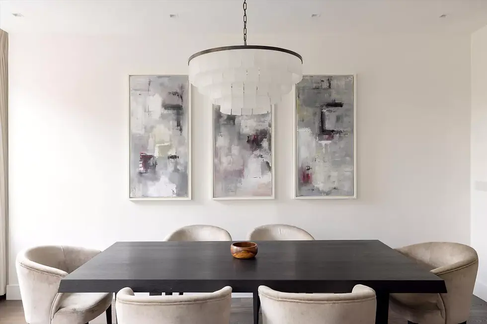 The dining area was elevated by a bespoke triptych of abstract canvas art, custom-painted to complement the neutral palette and bring dynamic energy to the space.