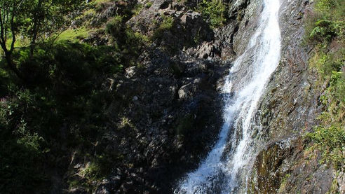 Witness the impressive waterfall in a natural gorge