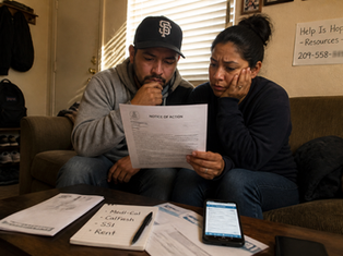 A concerned couple in Modesto reviews a "Notice of Action" letter, contemplating the impact of moving in together on their Medi-Cal, CalFresh, and SSI benefits, while seeking resources for guidance.