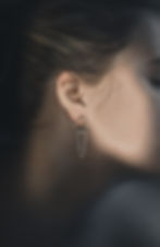 Silver earrings, geometrical forms with chains, minimalist design, fashion accessories.