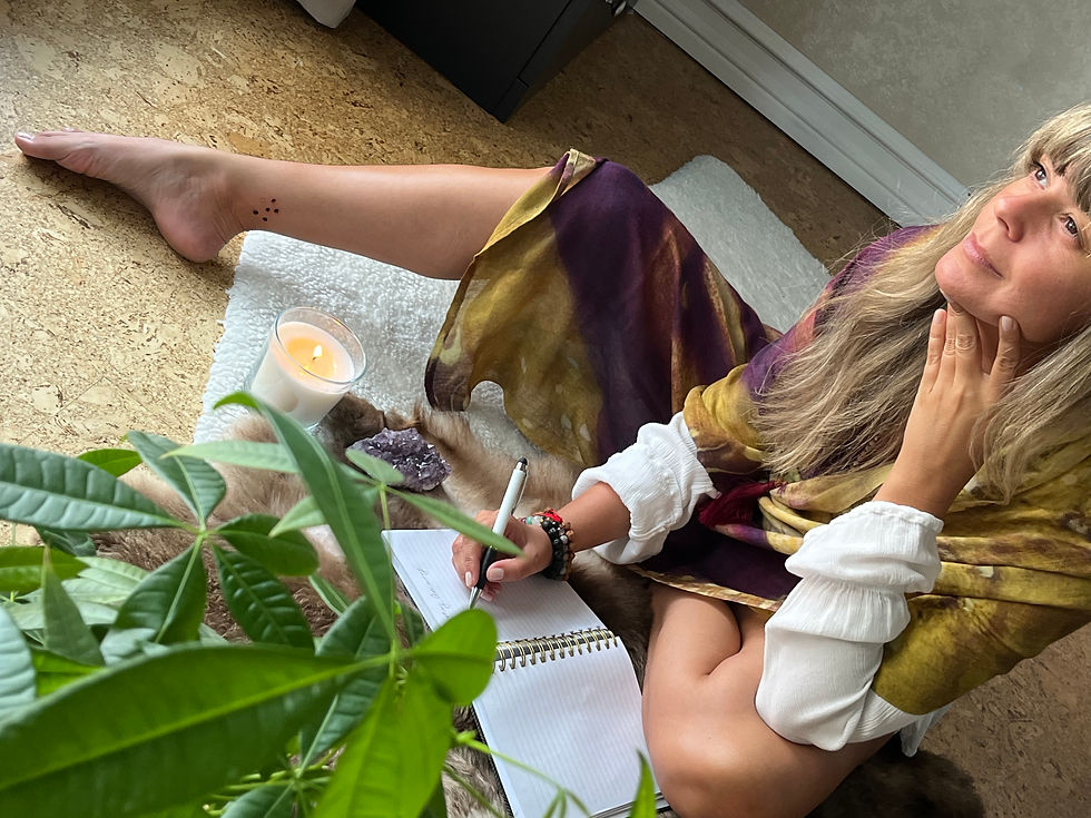 Writer. Woman sitting. Candle. Plant. Book. Scarf.