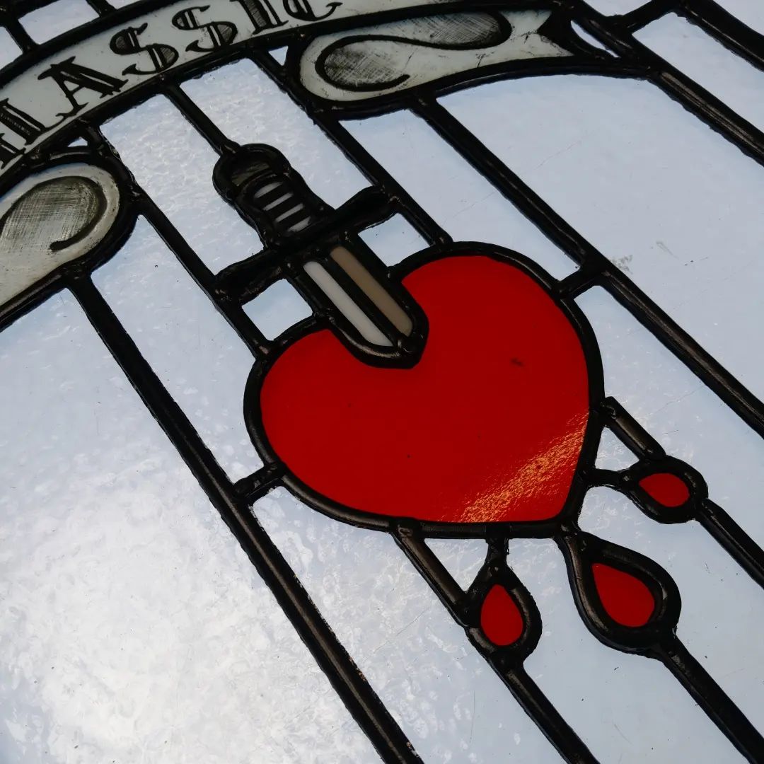 Tattoo-style stained glass artwork with bold outlines and vibrant colors