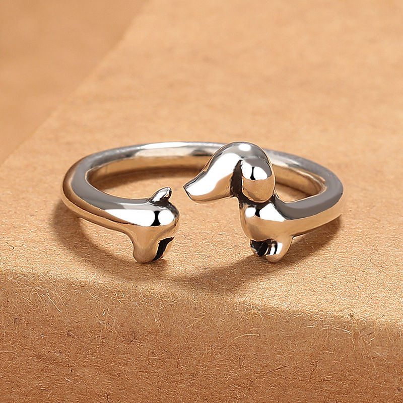 Close-up view of the Dachshund head and tail silhouette with vintage Thai-silver finish