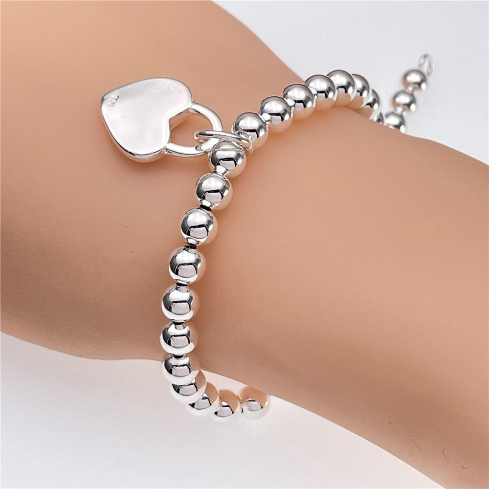 925 sterling silver woven mesh toggle bracelet worn on a model's wrist