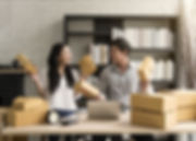 Man and woman handling orders