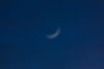 Crescent moon in a dark blue night sky