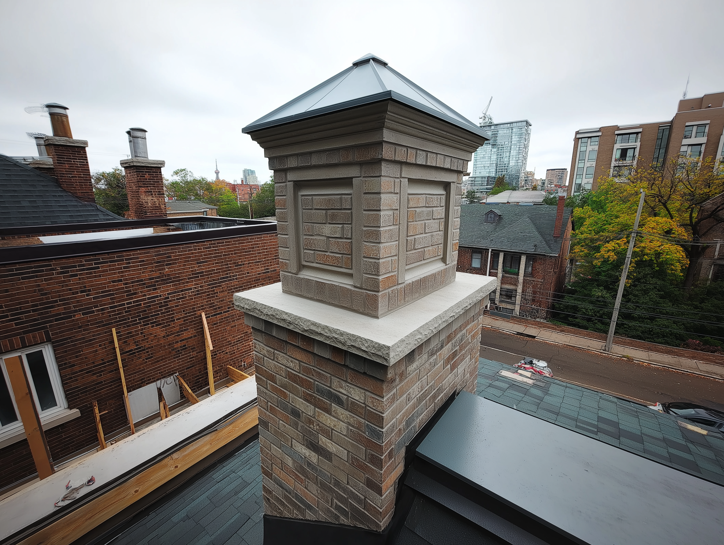 Old unused brick chimney with failing flashing