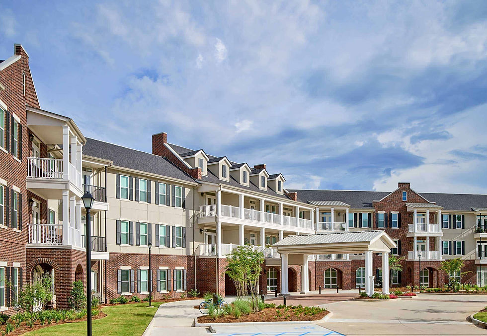 Brick residential building with balconies and covered entryway