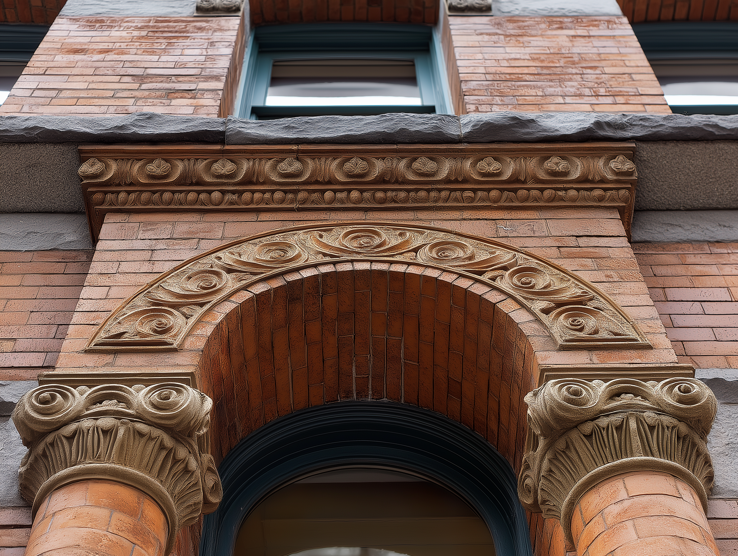 Brick facade with grime, efflorescence and algae