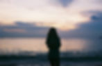 Silhouette of woman at sunset beach