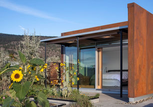 Contemporary home Glass House with natural materials and mountain vista