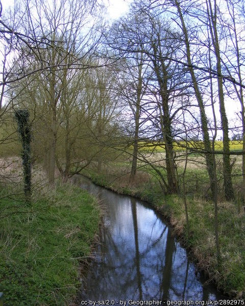 Photo of the river fromus, a small river running through a rural winter landscape with leafless trees on either bank. Photo https://www.geograph.org.uk/photo/2892975 © Copyright Geographer and licensed for reuse under a cc-by-sa/2.0 Creative Commons Licence https://creativecommons.org/licenses/by-sa/2.0/