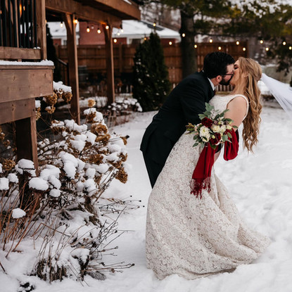 testimonial from couple | groom dipping bride and going in for a kiss