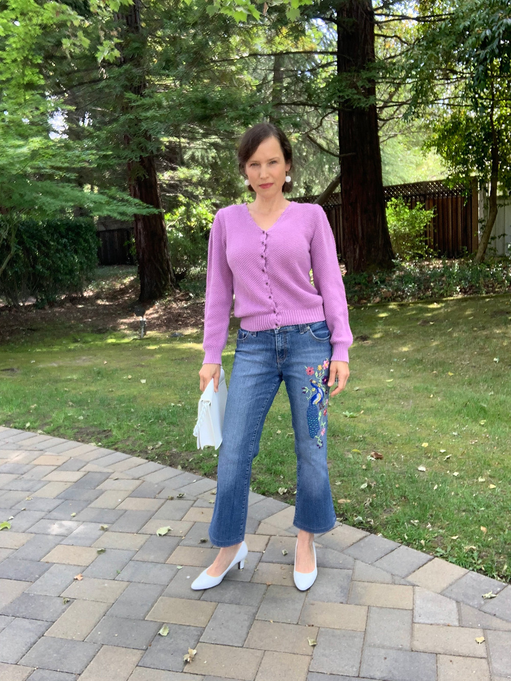 finished crop flare jeans with white heels and lavendar sweater