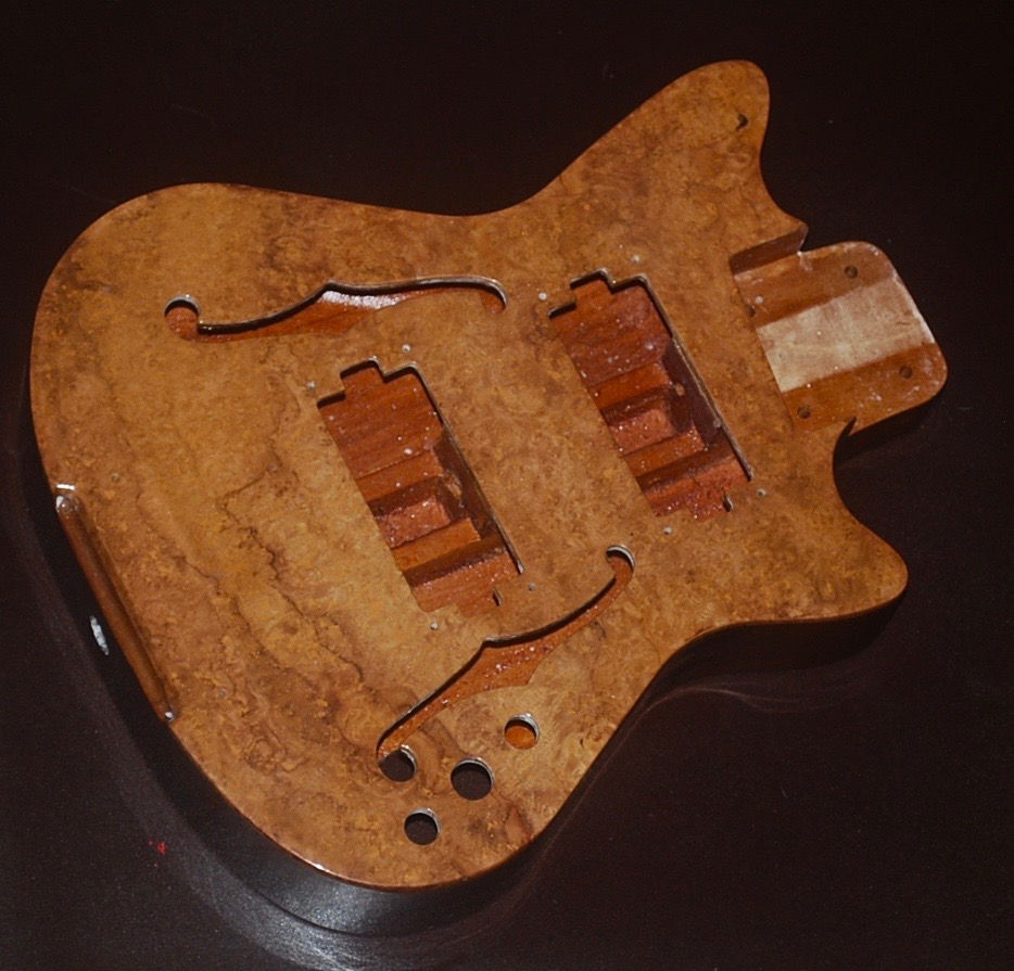 Lapaxe™ Semi acoustic Mahogany Body with an Amboyna Burl Top.