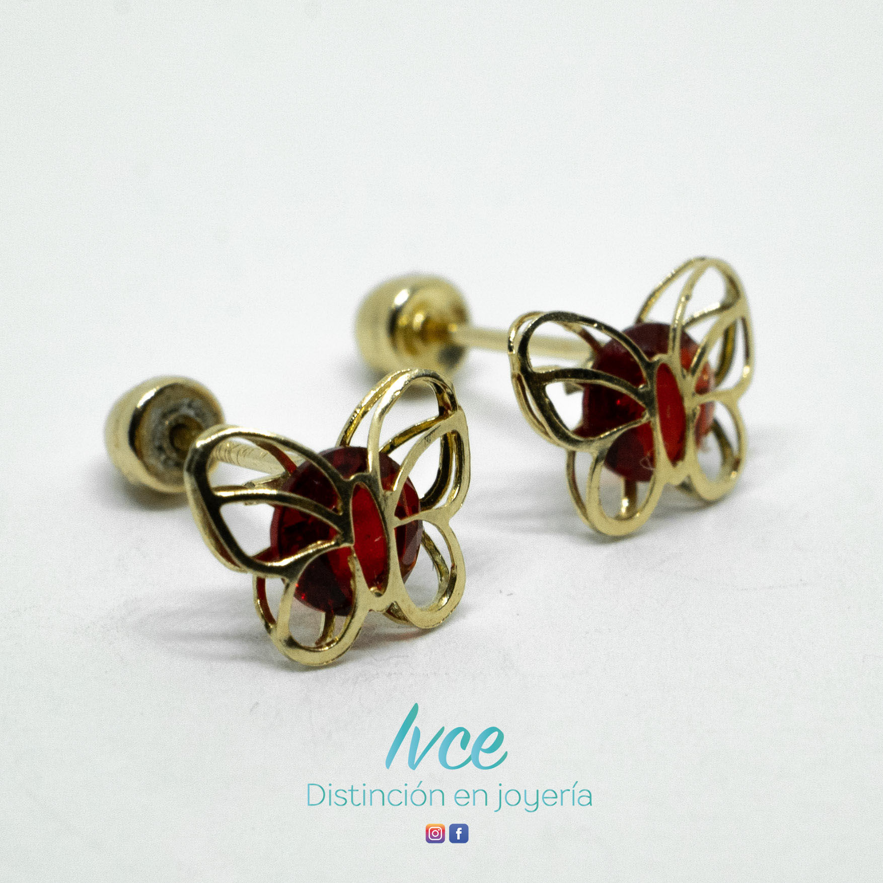 Aretes de oro con zirconia roja