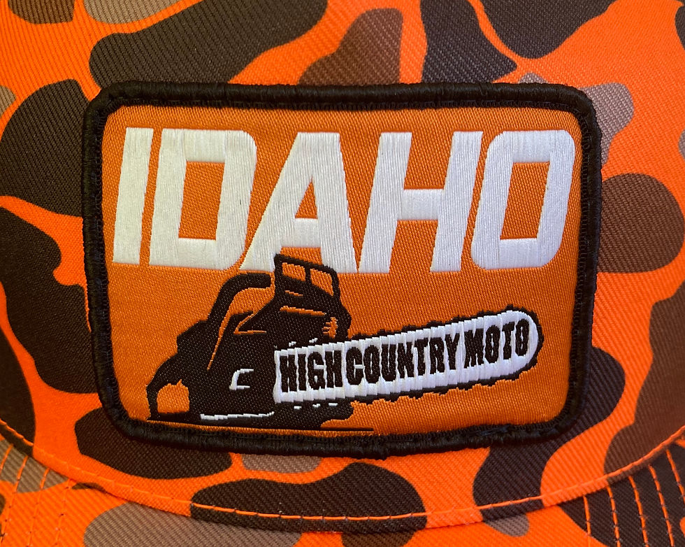 Thumbnail: Idaho High Country Moto Chainsaw • Blaze Orange Camo Trucker