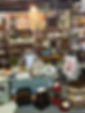 Vintage dishes, collectibles, and home décor displayed at a vendor booth