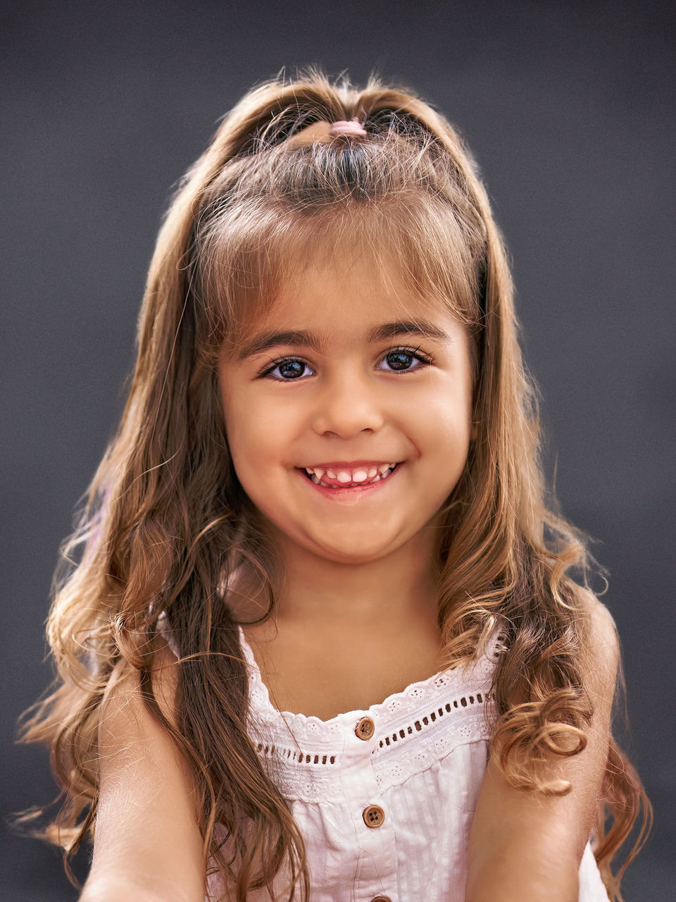 Homeschool school portrait of a young girl with dark hair on a gray Slate background by Instant School Photos