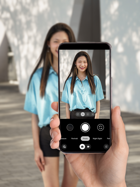 Parent taking a photo of daughter for Instant Shcool Photos
