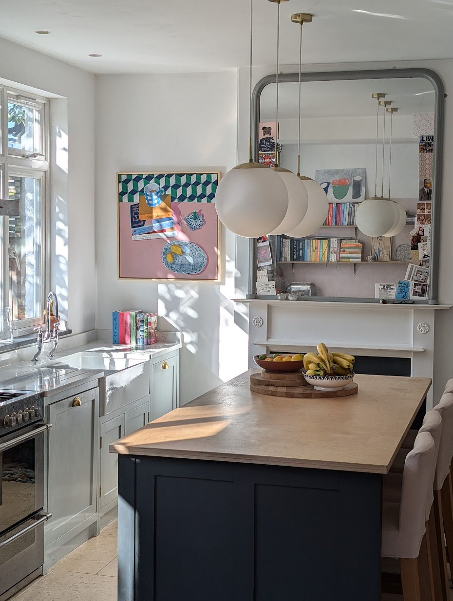 Full view of a painting of cookery books and pottery, far view in a kitchen setting