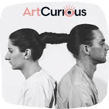 Two people sit back-to-back with braid connecting their hair. The word "ArtCurious" is above in bold text. Monochrome image.