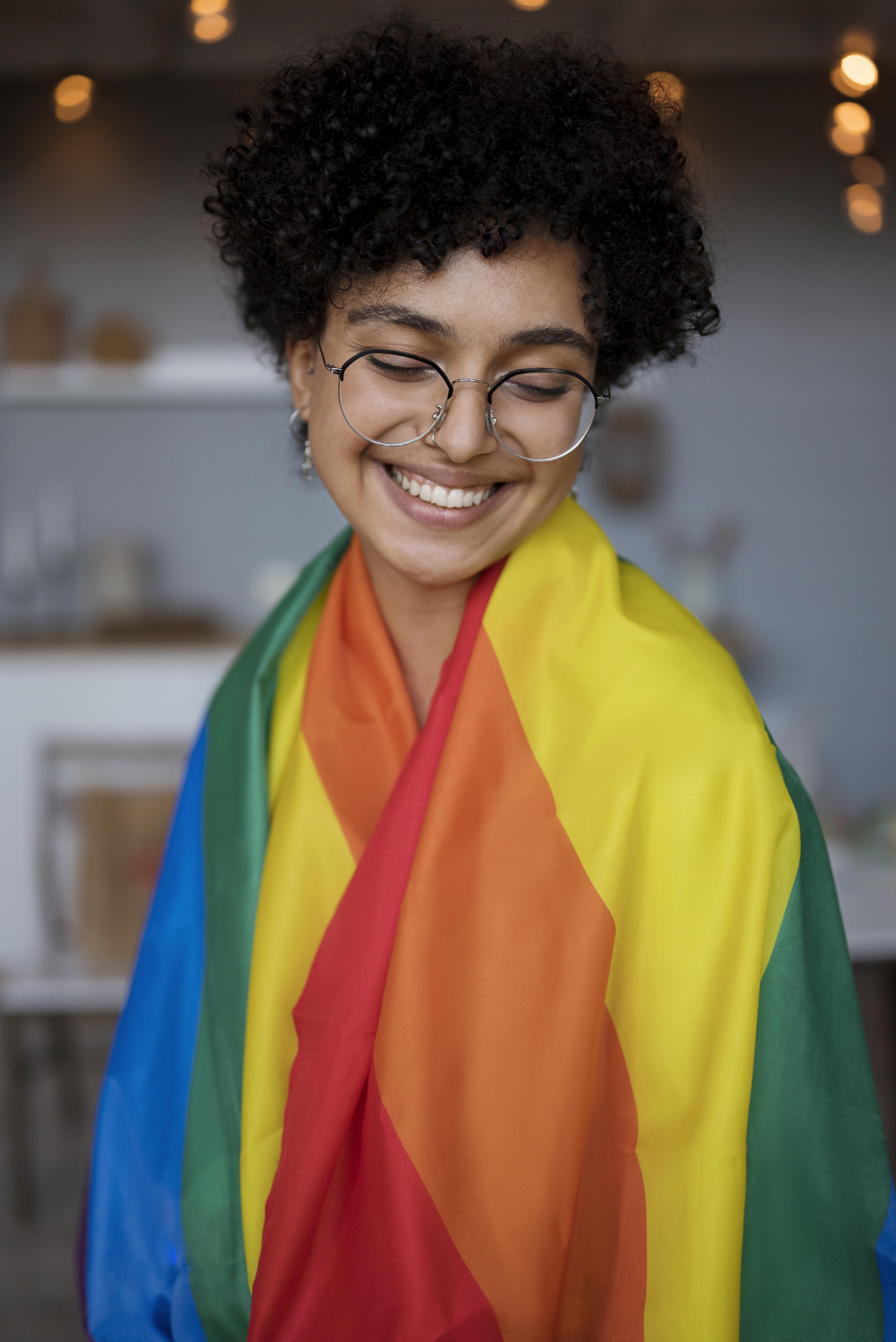 beautiful-curly-woman-with-lgbt-flag.jpg