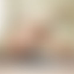 Pregnant woman practicing gentle yoga in a calm, earthy home environment with soft natural light.