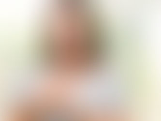 Woman with hand mindfully on her heart, suggesting healing 