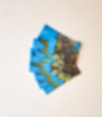 A stack of stickers made out of the original artwork of Te Fiti from Moana spread out