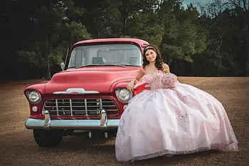 Western Quinceañera theme with rustic decorations, cowboy boots, elegant quince dress, and country-inspired décor for a 2027 celebration.