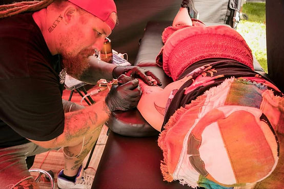 Tattsart giving tattoos at the extravaganza fair.jpg