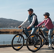 full-shot-family-cycling-together.jpg